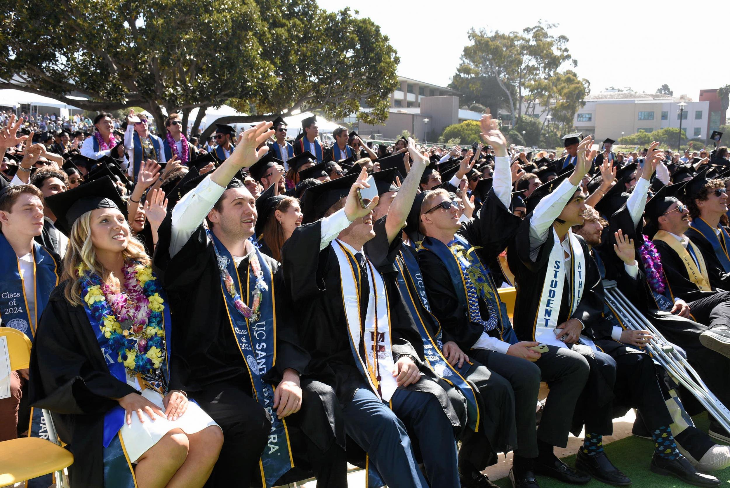 Students in the front row of graduation ceremony