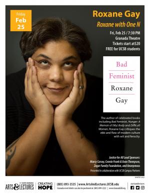 Roxane Gay smiling facing forward with hands resting in chin